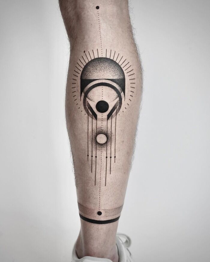 Geometric calf tattoo design with abstract shapes and lines showcasing coolness.