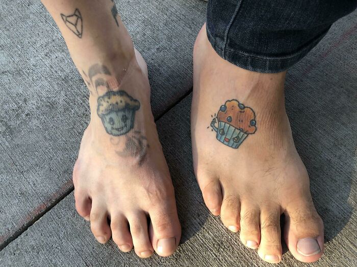 Tattoos of muffins on feet, humorously aligning with the situation.