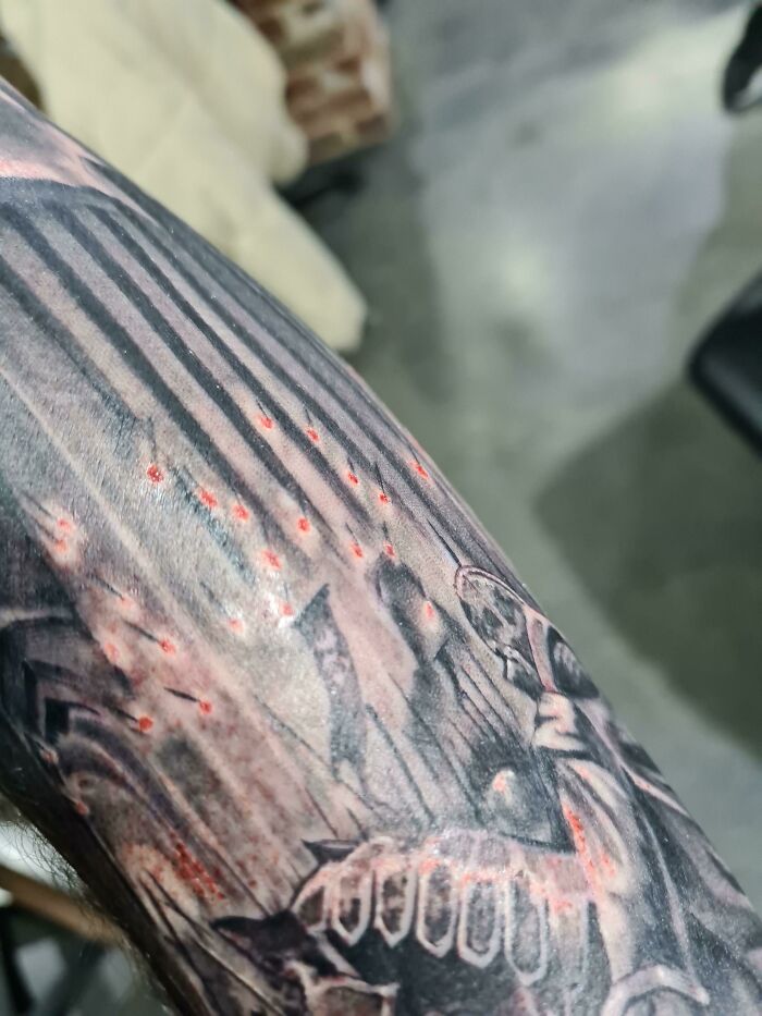 Fresh Black And Grey Tattoo Bled Making The Arrows Look On Fire