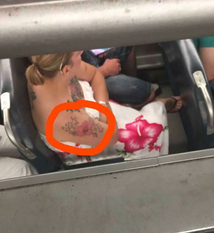 This Lady On The Train With The Same Flower On Her Dress And Her Tattoo