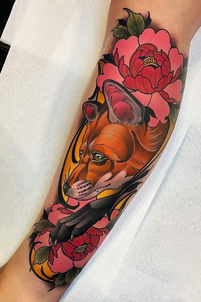 Colorful calf tattoo featuring a fox surrounded by vibrant pink flowers and green leaves.