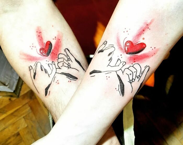 Matching tattoos with hands and hearts, symbolizing love and connection for couples or special people in your life.