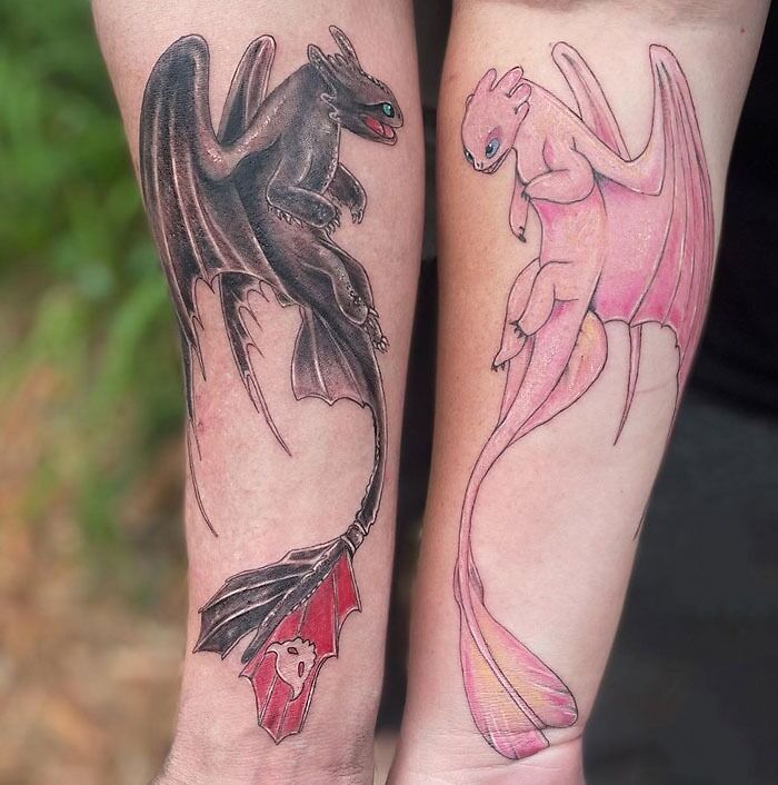 Matching dragon tattoos on forearms, perfect for couples or siblings showcasing their bond with unique designs.