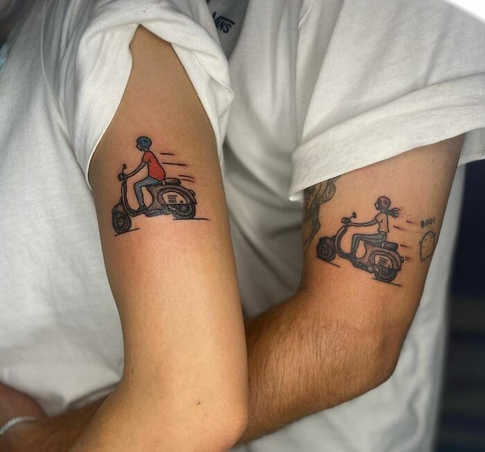 Matching tattoos of two people on scooters, symbolizing partnership and connection.