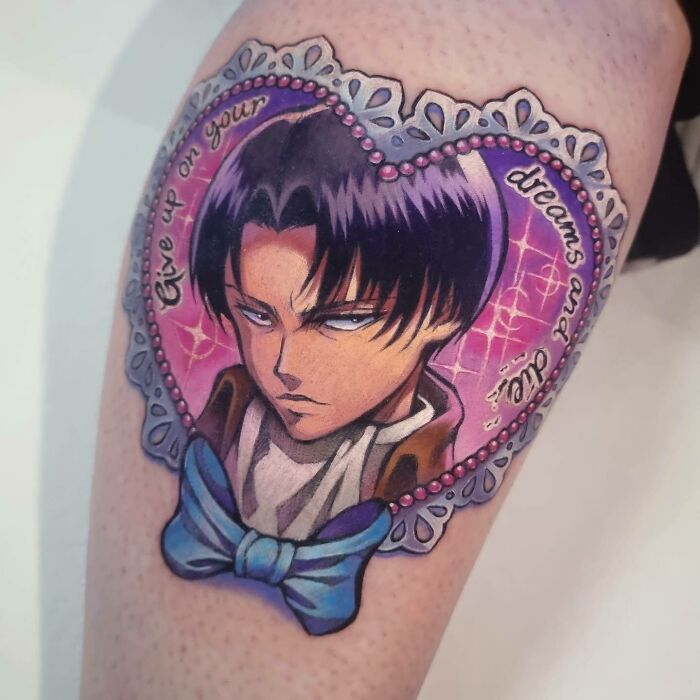 Self-love tattoo featuring Levi with "Give Up On Your Dreams And Die" framed in a heart with a blue bow.