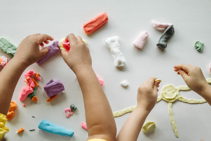 Two kids playing with Play-Doh