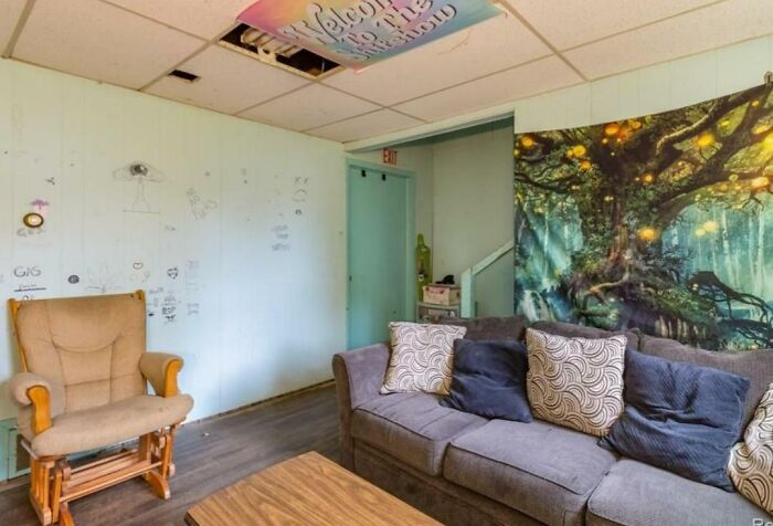 Covering Up The Missing Tile On The Ceiling With That Sign Will Totally Help Sell This House