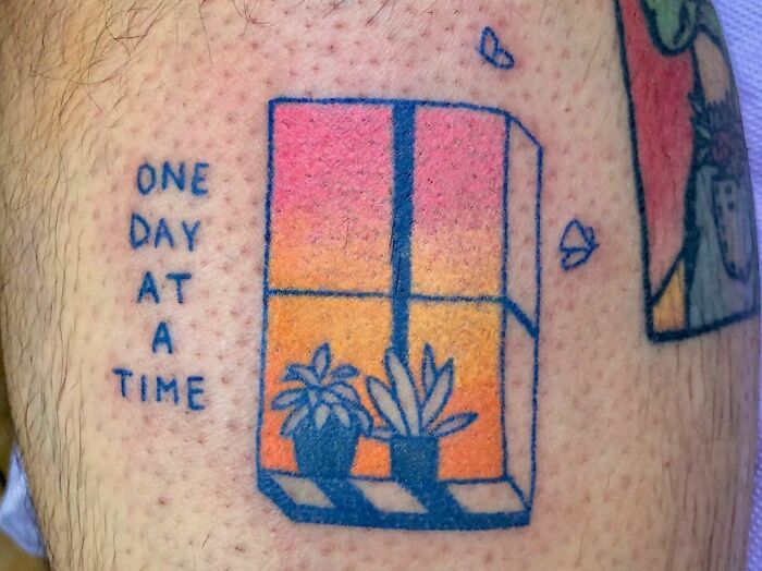Self-love tattoo with "One Day At A Time" and sunset window design.