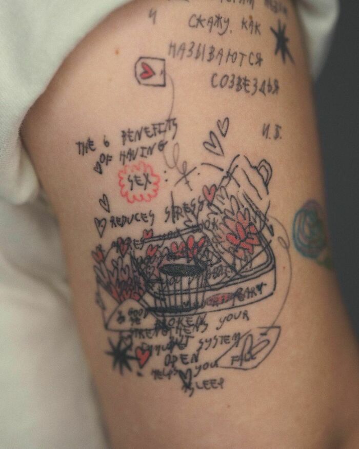 A chaos tattoo with handwritten words and doodles celebrating self-love.