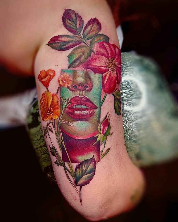 Colorful self-love tattoo on an arm, featuring floral elements and a face, symbolizing empowerment and deep meaning.
