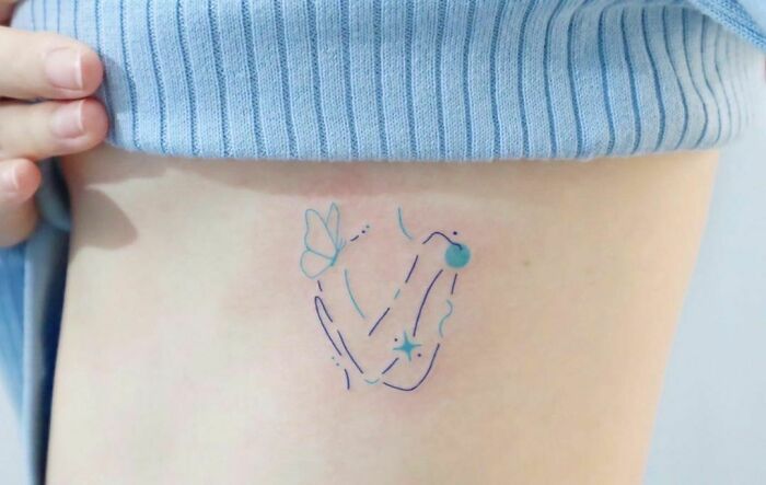 Minimalist woman hugging herself tattoo with pastel colors.