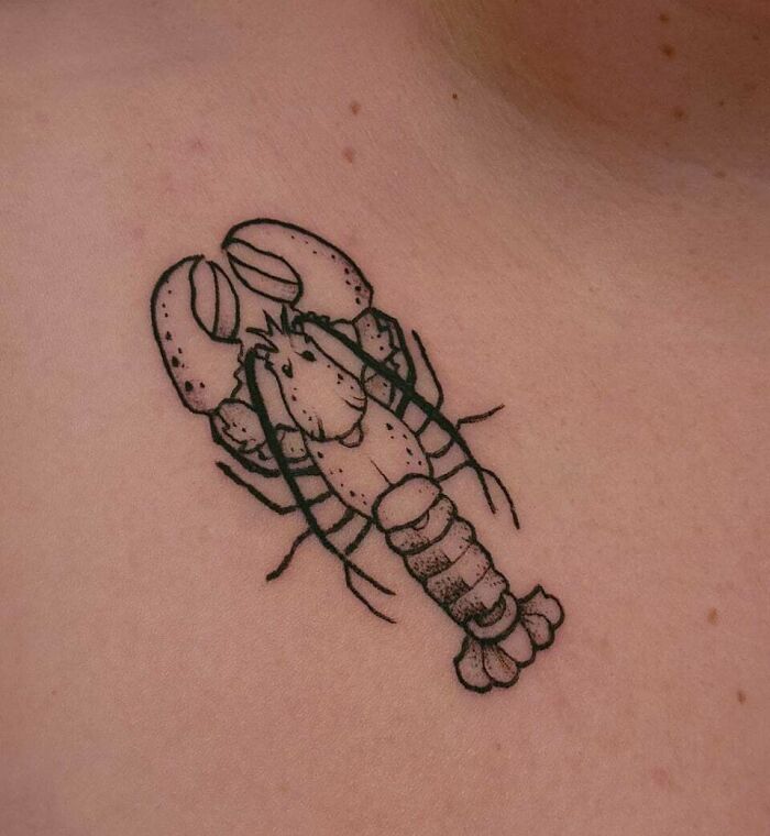 Simple and realistic lobster tattoo design on skin, showcasing animal tattoo art.
