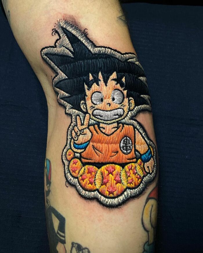 Tattoo by Eduardo Lozano featuring a 3D anime character design on an arm, showcasing unique embroidery style.