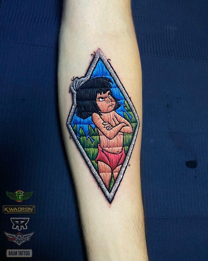 Tattoo by Eduardo Lozano featuring a colorful character design on a forearm, showcasing unique dimension in tattooing.