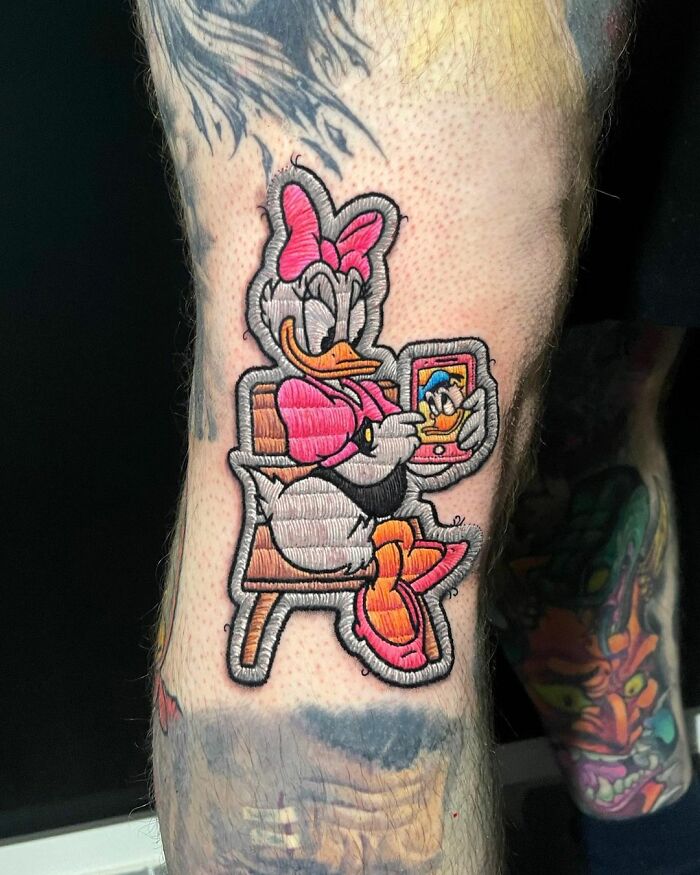 Tattoo by Eduardo Lozano, showcasing a colorful cartoon character in new tattooing dimension style.