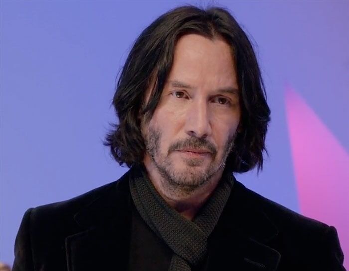 Keanu Reeves standing and looking in movie Always Be My Maybe