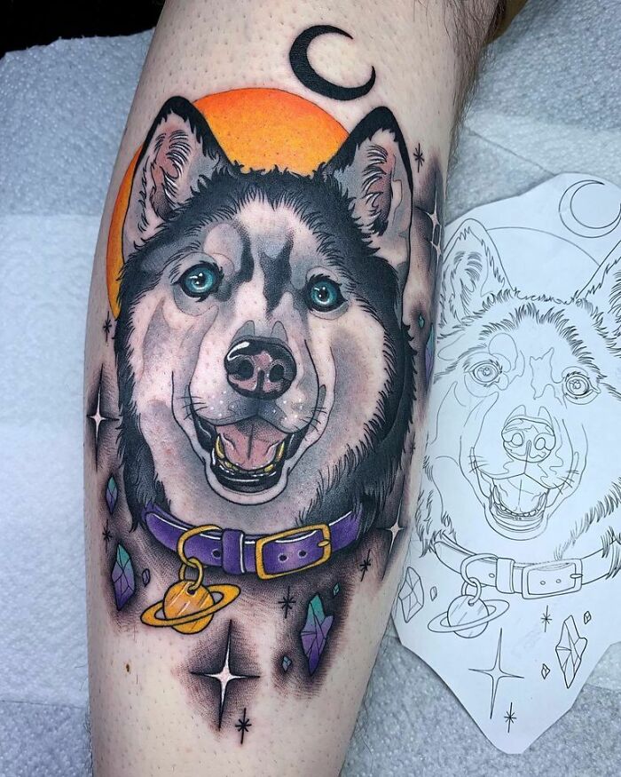 Space tattoo of a dog with planets and crystals, featuring a crescent moon and vibrant colors for astrology fans.