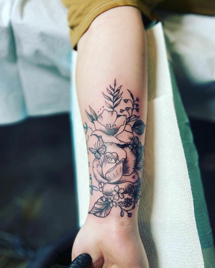 Floral tattoo design on arm radiating elegance and beauty.