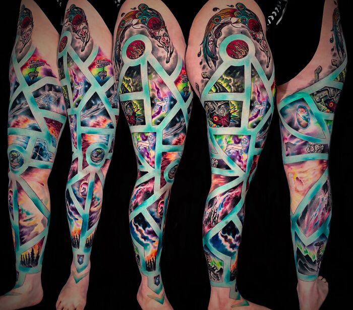 Cosmic-themed tattoos with vibrant colors and space elements on a leg sleeve design.