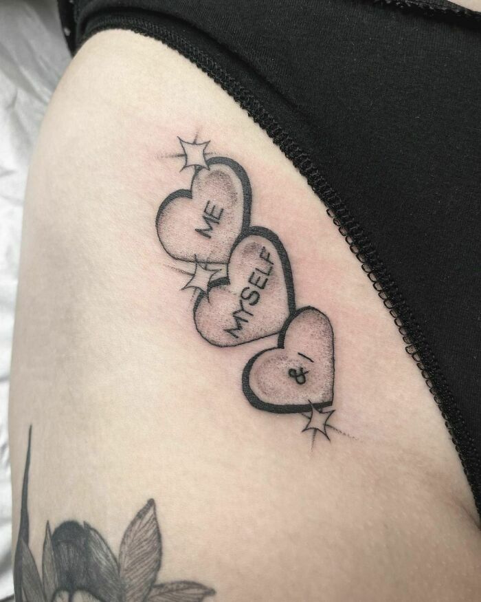 Self-love tattoo with three hearts labeled "Me," "Myself," and "I," symbolizing personal empowerment.