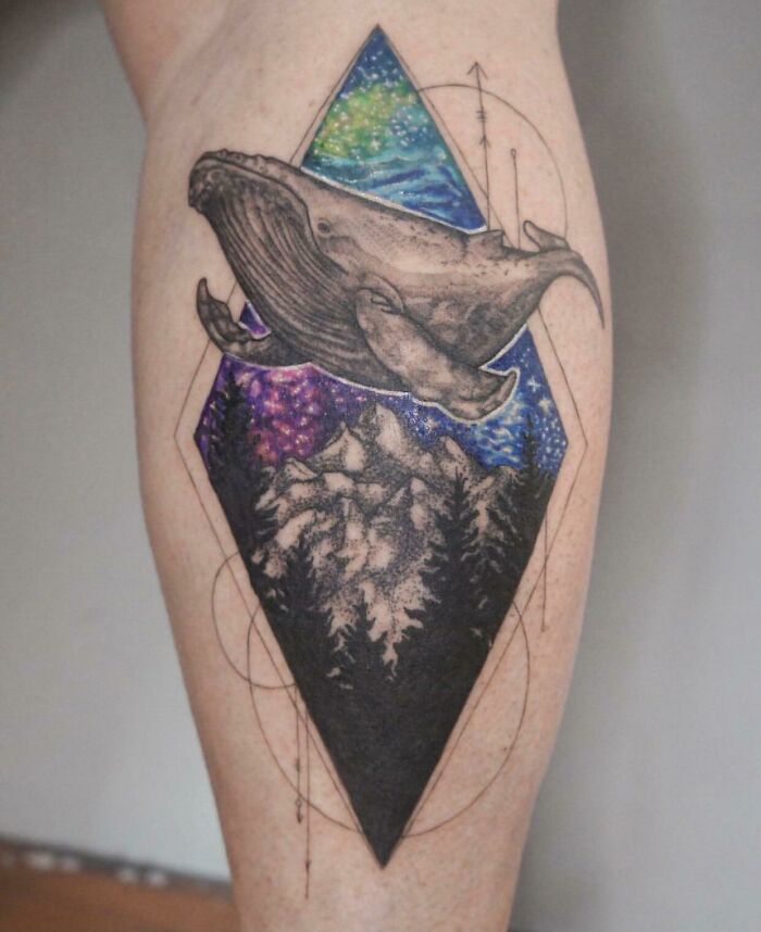 Whale and forest space tattoo featuring vibrant cosmic background with stars and galaxies.