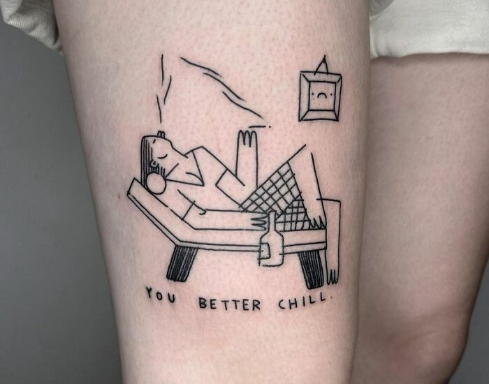 Self-love tattoo showcasing a relaxed figure on a couch with text "You Better Chill" beneath.