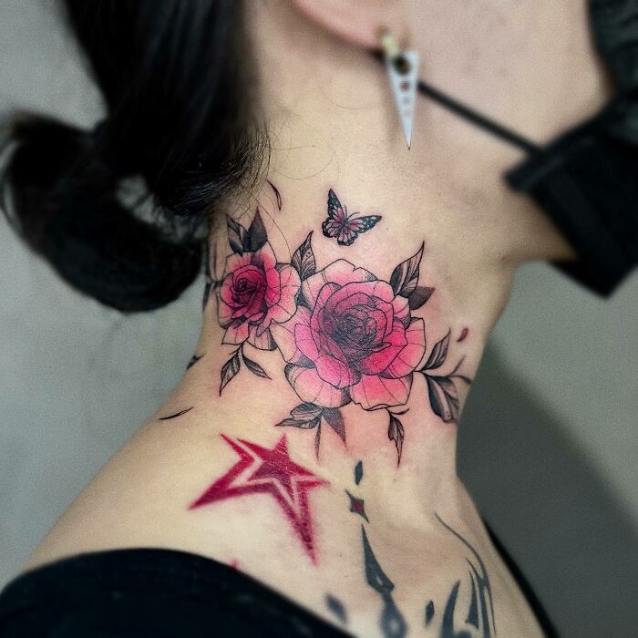 Neck tattoo with pink flowers and a butterfly, showcasing intricate flower tattoos blossoming on the skin.