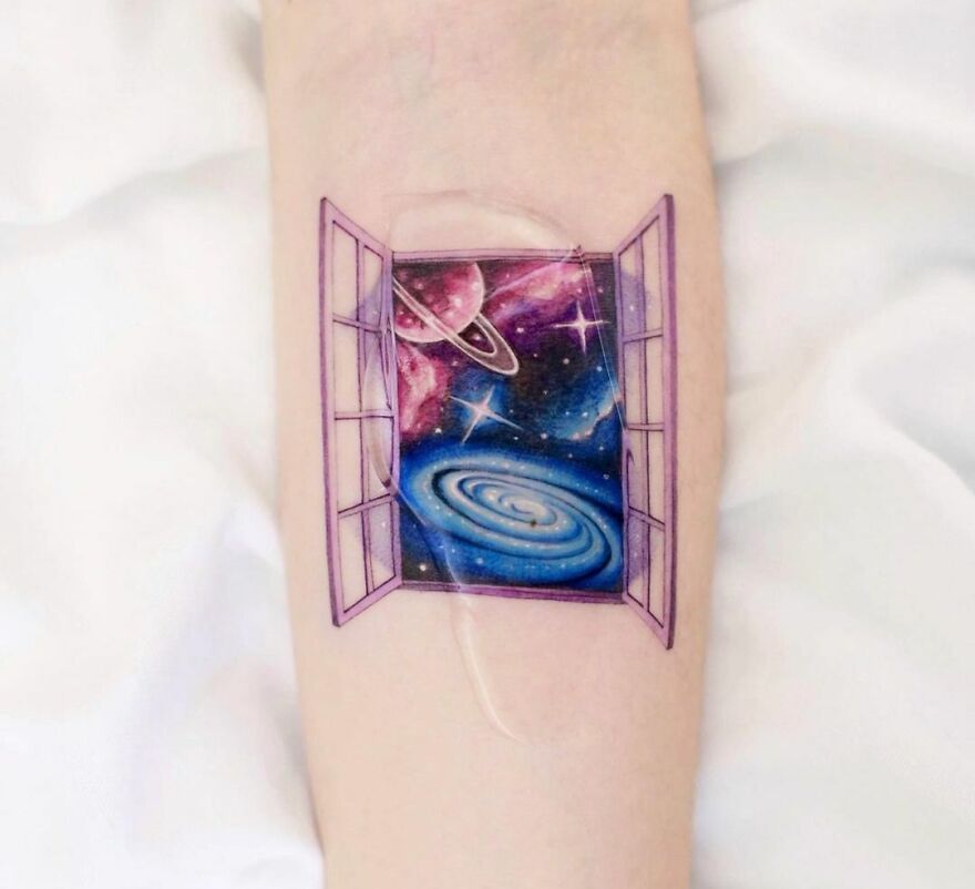 Space tattoo of a galaxy view through an open window on forearm, ideal for astrology fans.