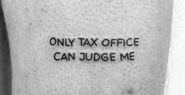 Self-love tattoo with "Only Tax Office Can Judge Me" phrase.