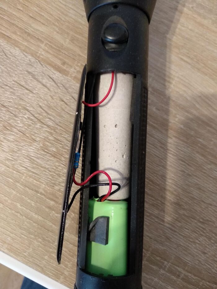 The Solar Panel Of My Flashlight Came Off And Reveals A Block Of Concrete To Make It Feel More Well-Built And Heavy