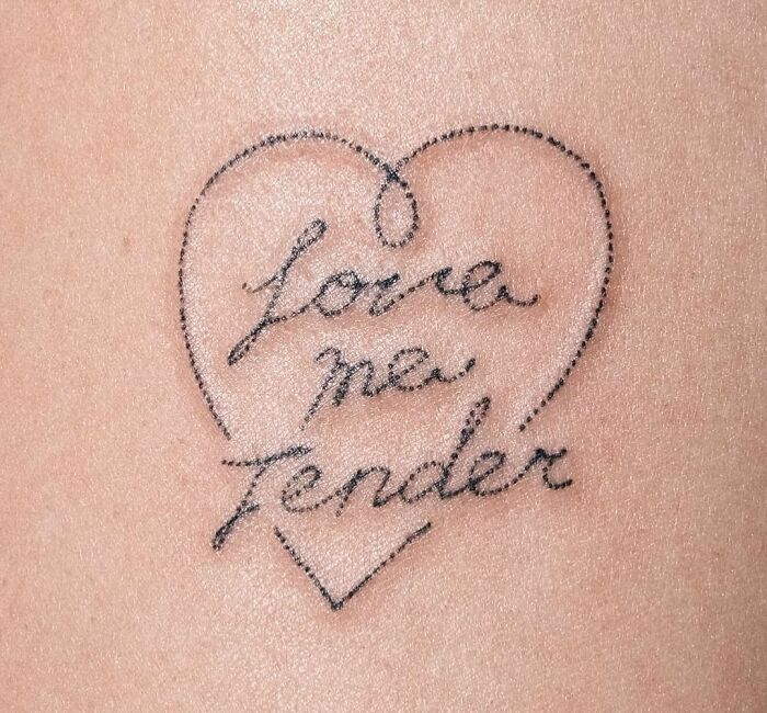 Heart-shaped self-love tattoo with "Love Me Tender" text.