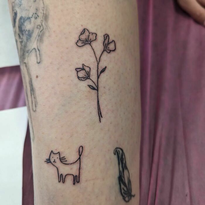 Simple flower tattoo on arm radiates elegance and beauty.