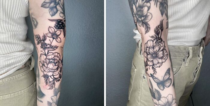 Black and white floral tattoo on person's arm, featuring elegant flower and butterfly designs.