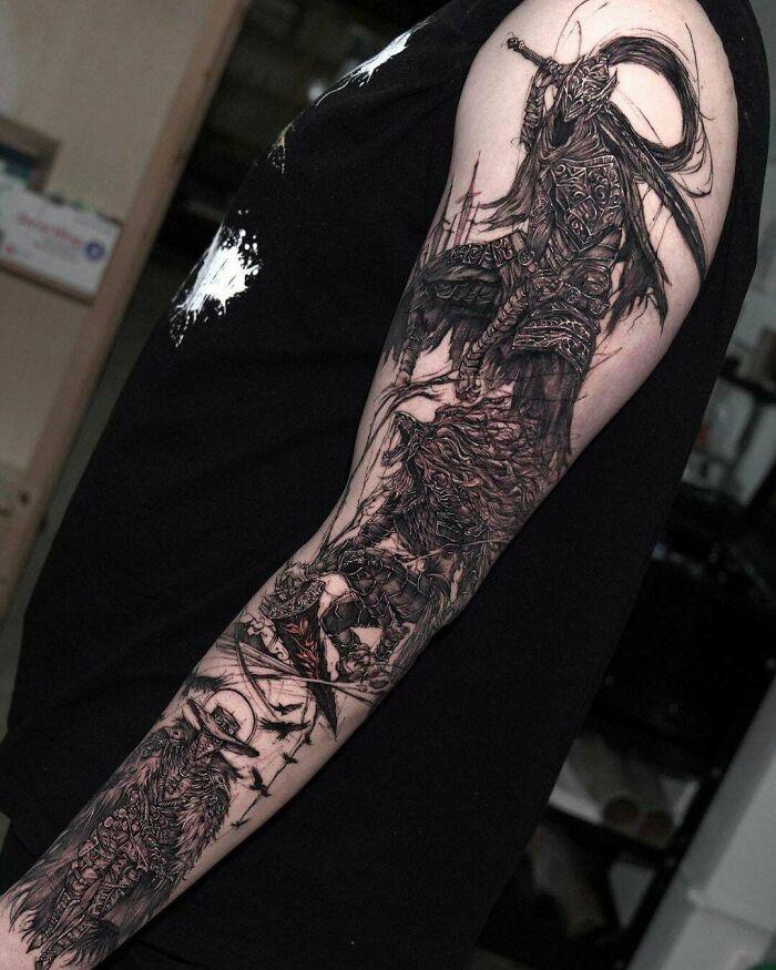 A super realistic tattoo depicting a warrior with intricate detailing on an arm.