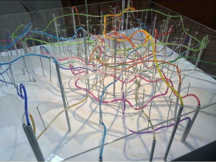 Colorful model showcasing the beauty of well-planned infrastructure with interconnected pathways and support structures.