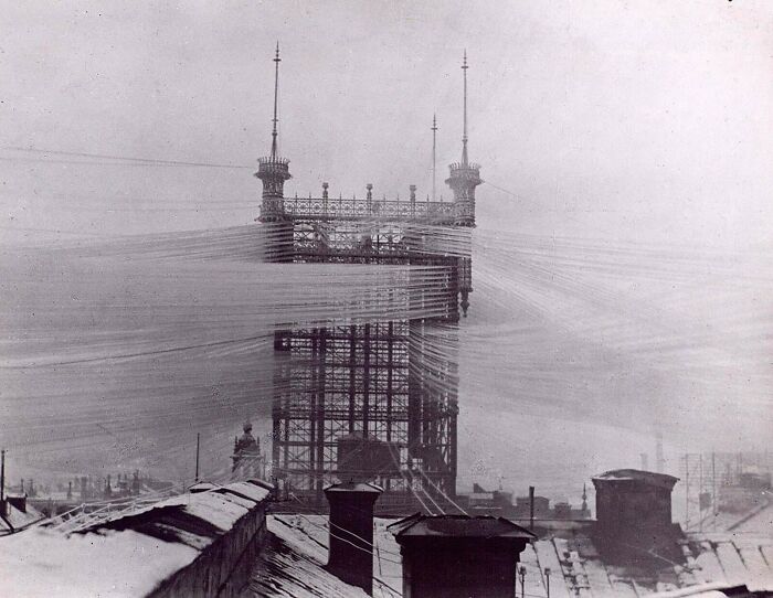 Historic photo showing complex network of wires and cables highlighting the beauty of well-planned infrastructure.