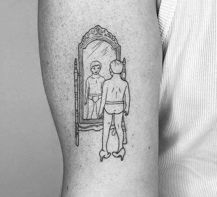 Line drawing tattoo of a figure in heels looking into a mirror, reflecting childhood nostalgia.