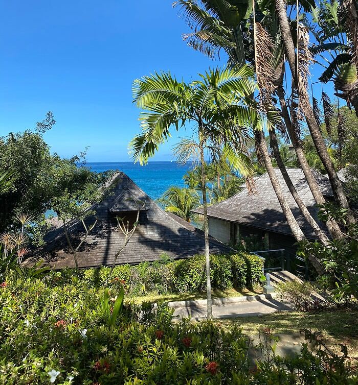 Tropical beach with wooden houses 