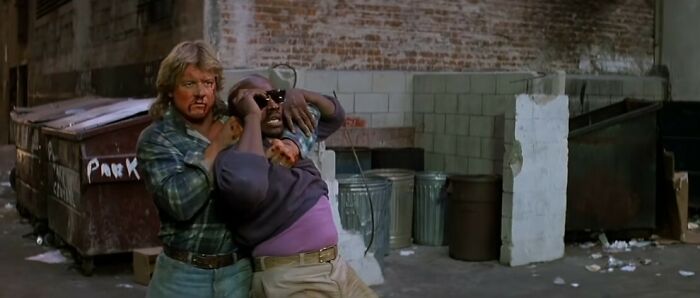 Nada and Frank fighting on the street 