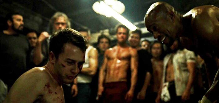 two man fighting o the ring 