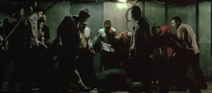 A group of man fighting 