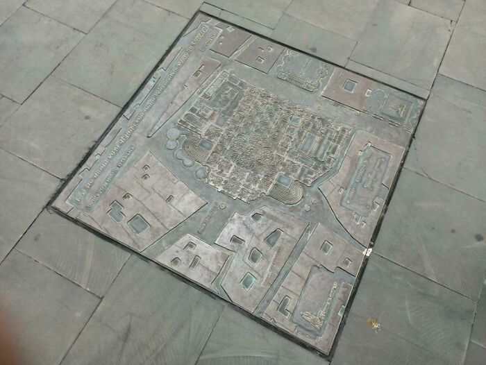 There's A Map Of The District On This Plate In The Street