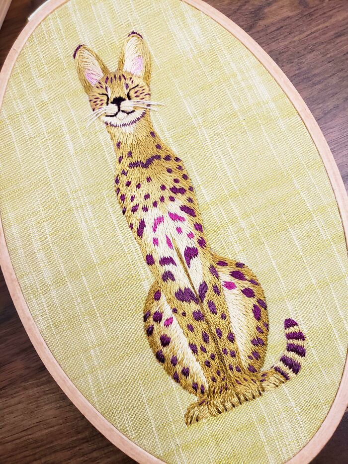 Serval In An Oval Hoop