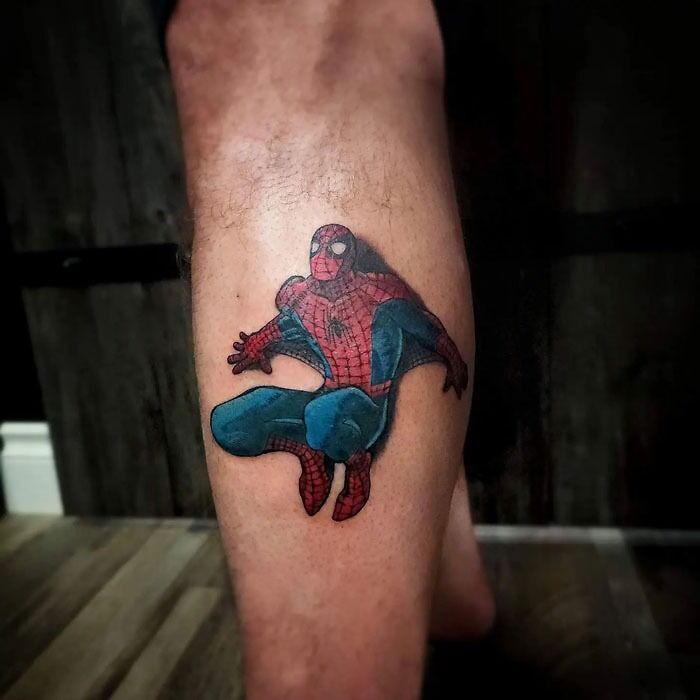 Unique calf tattoo of a superhero character in a dynamic pose.