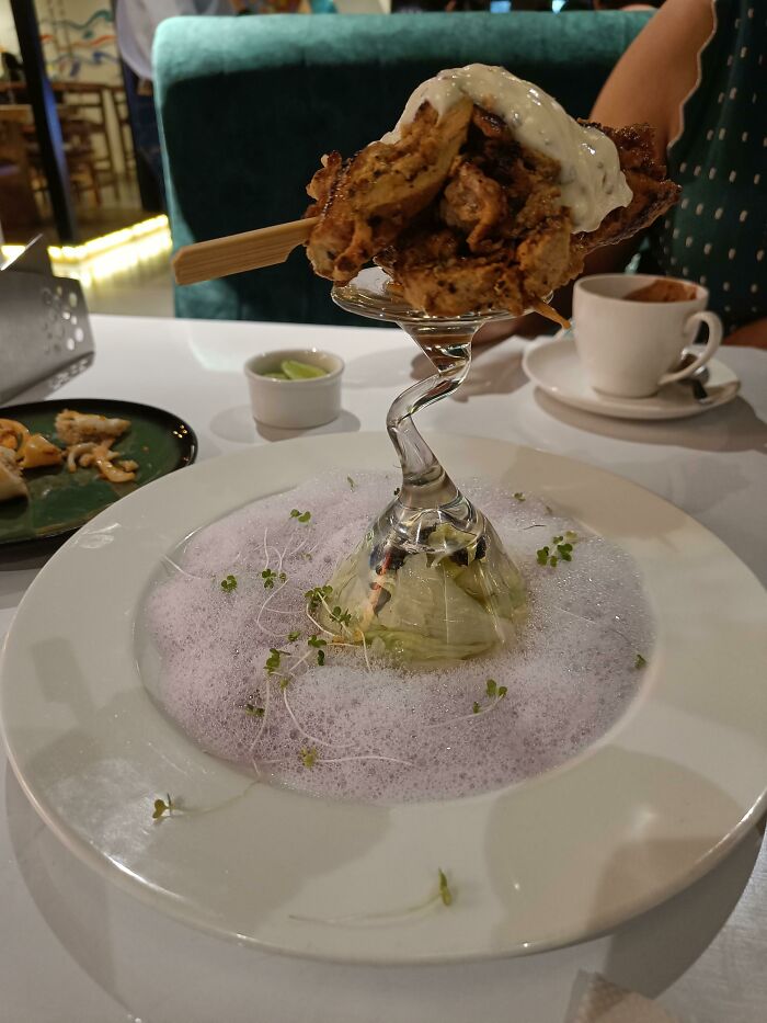Skewered Chicken Served On Top Of The Bottom Of A Glass(?)