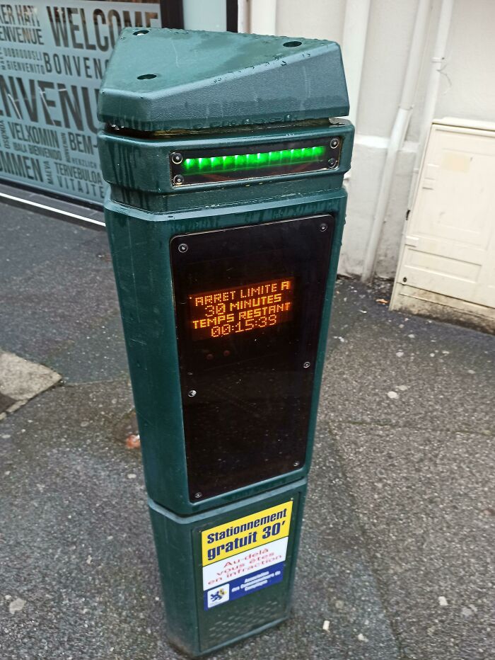 Parking meter with LED display and free 30-minute sign, an innovative gadget found in cities worldwide.