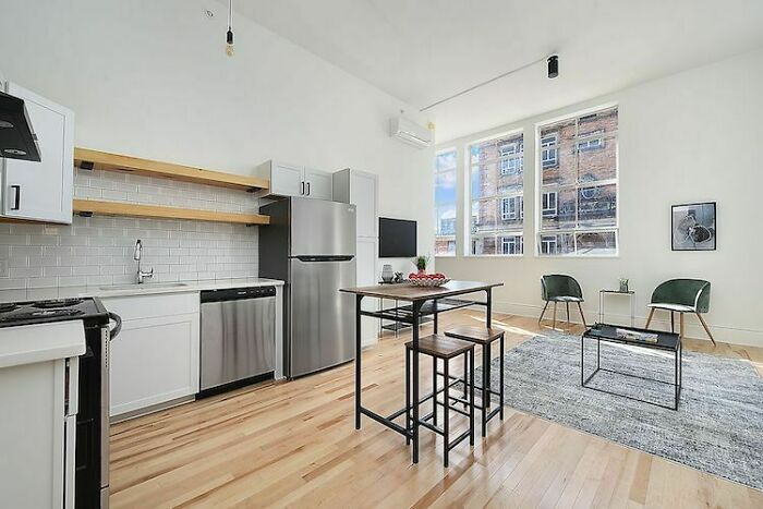 It Took 3 Years To Turn An Abandoned 1929 School Building Into This 31-Apartment Residential House