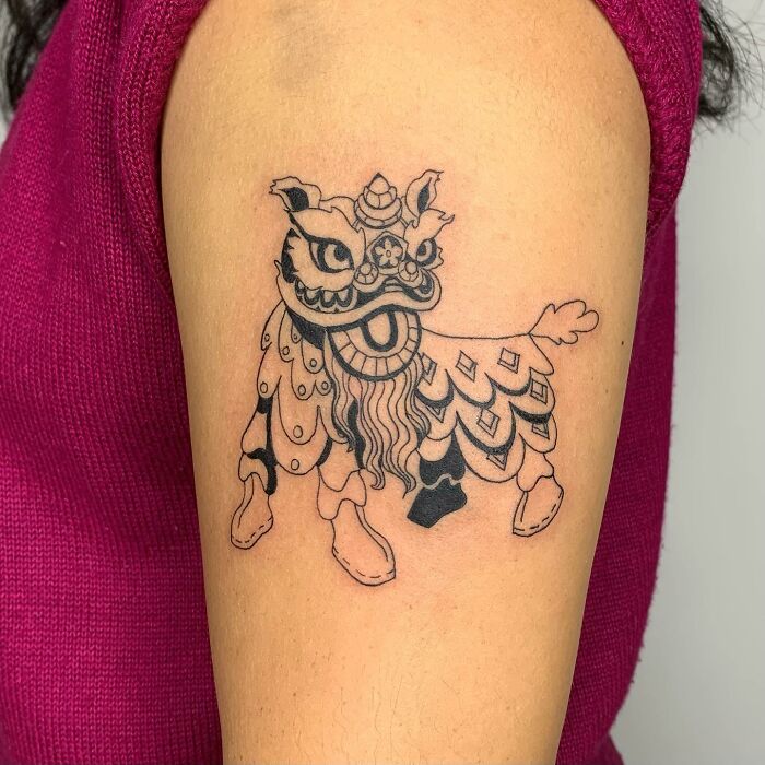 Tattoo of a mythical creature resembling a detailed illustration on an arm, showcasing the artist's style.