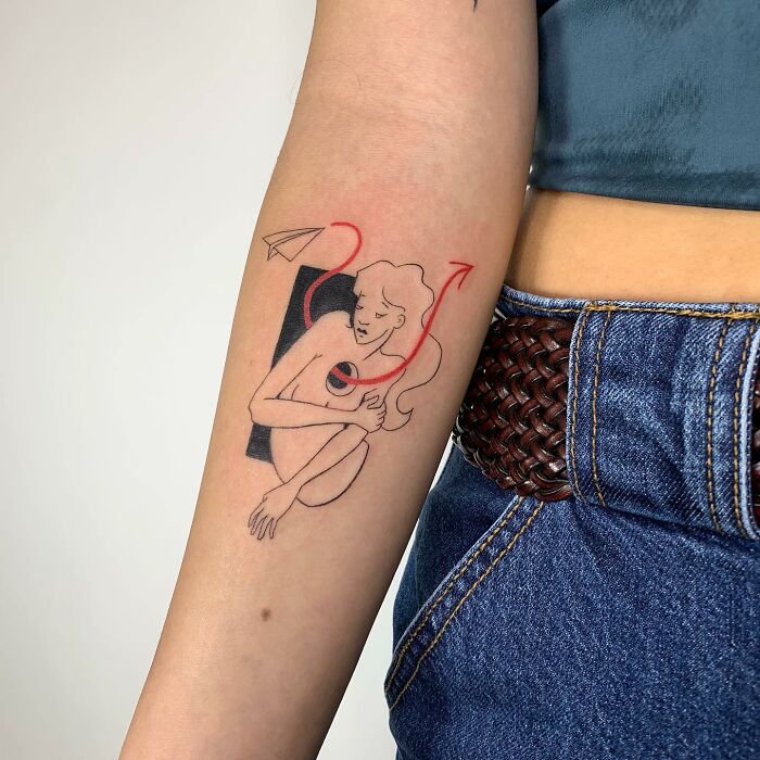 Illustration-like tattoo on a person's forearm, featuring abstract lines and a paper plane.