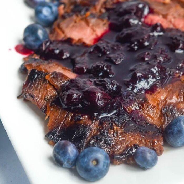 Steak with blueberries